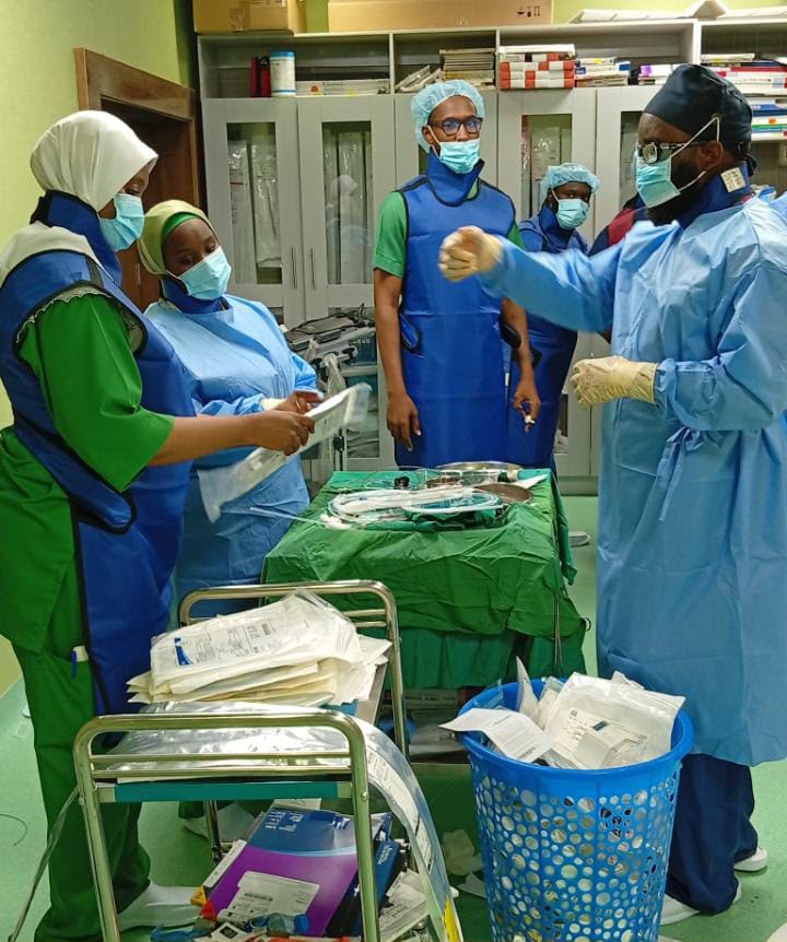 Clinical team preparing equipment in an interventional radiology suite in Maiduguri